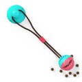 Suction cup interactive dog toy stuck to the floor with a ball attachment