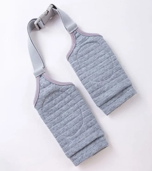 Dog wearing a cushioned knee protector and elbow support wrap
