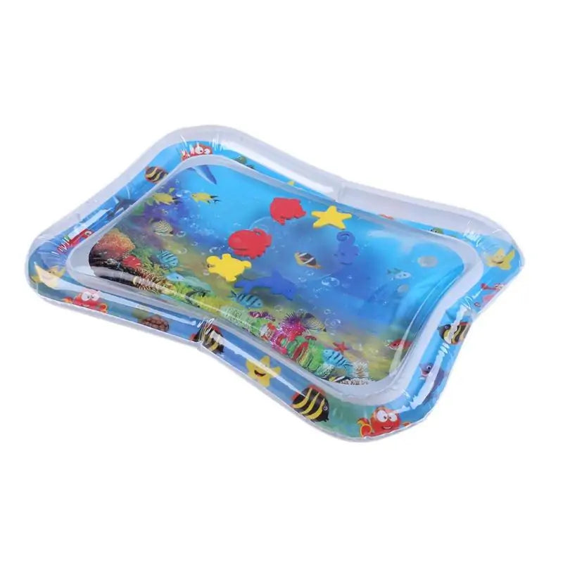 Dog playing on an inflatable water splash mat outdoors